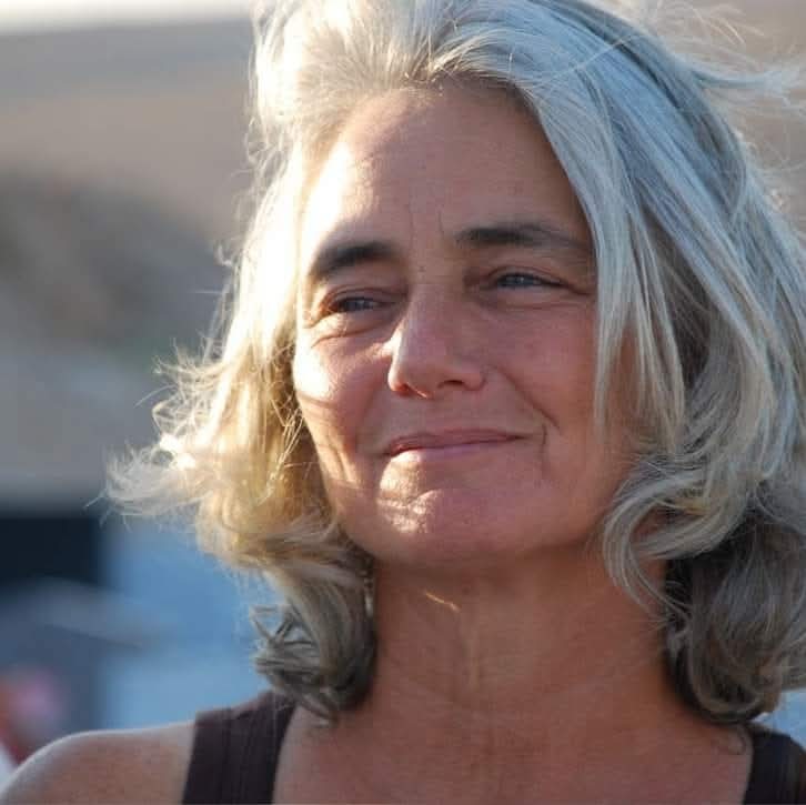 Taty Shoham Roth, Longevity tribe leader, smiling in golden evening light